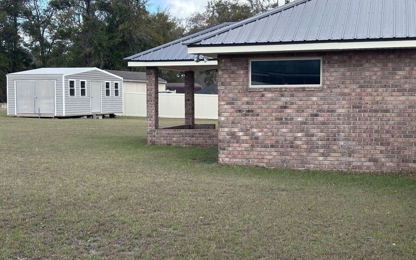 Move in ready, Beautiful brick home on large lot with new vinyl - photo 22