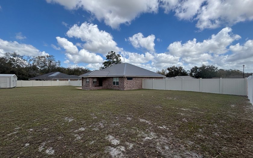 Move in ready, Beautiful brick home on large lot with new vinyl - photo 24