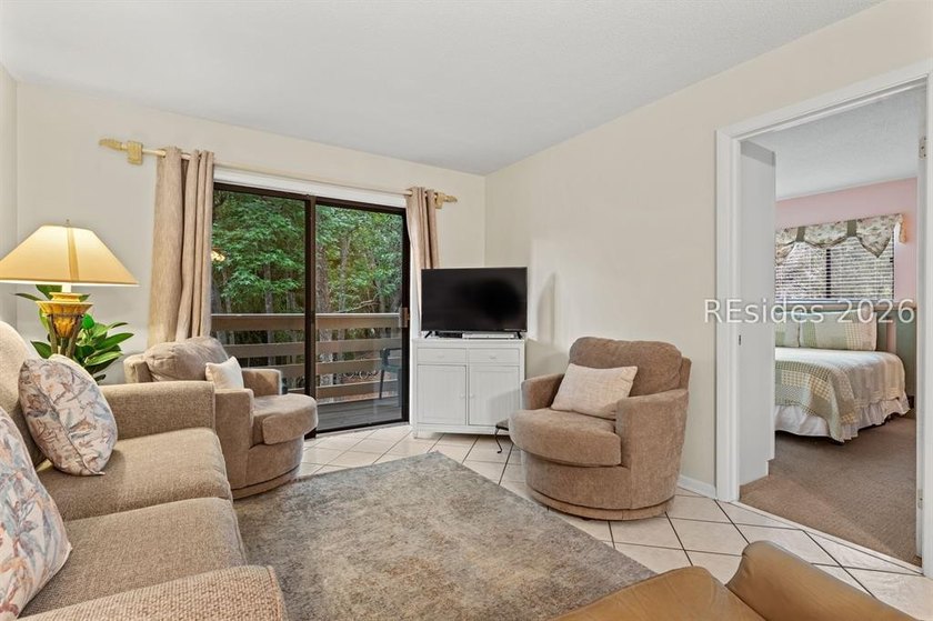 Tucked among mature landscaping in the highly desirable gated - photo 11