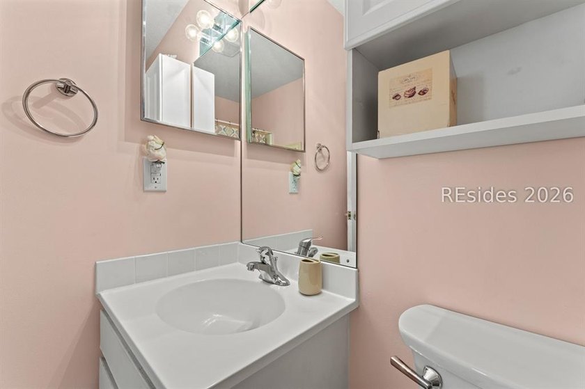 Tucked among mature landscaping in the highly desirable gated - photo 17