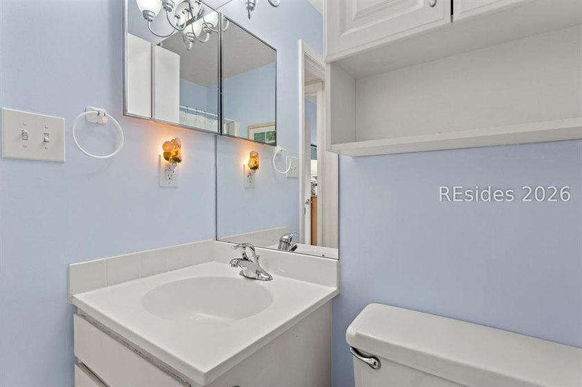 Tucked among mature landscaping in the highly desirable gated - photo 21