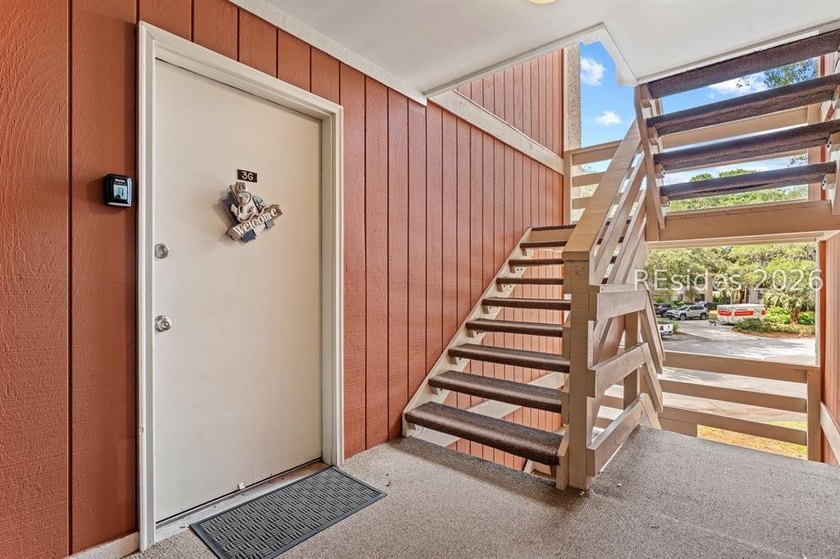 Tucked among mature landscaping in the highly desirable gated - photo 23