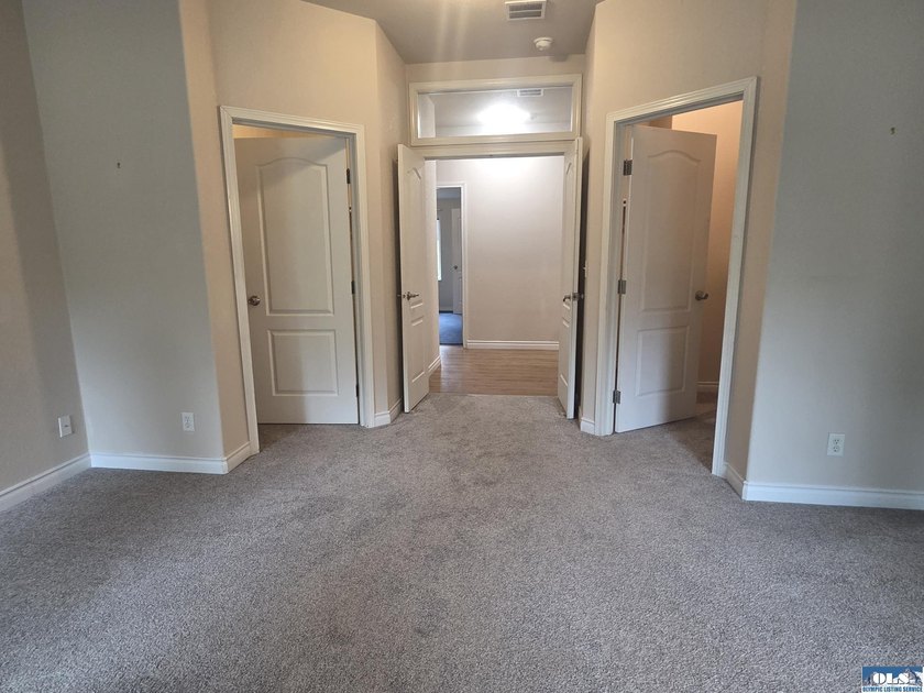 Space and natural light abound in this beautifully maintained - photo 16