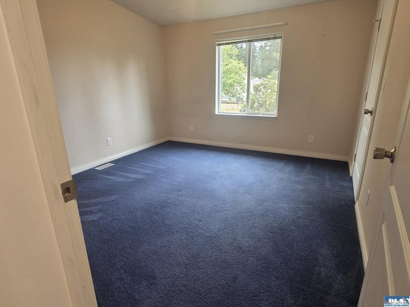 Space and natural light abound in this beautifully maintained - photo 24