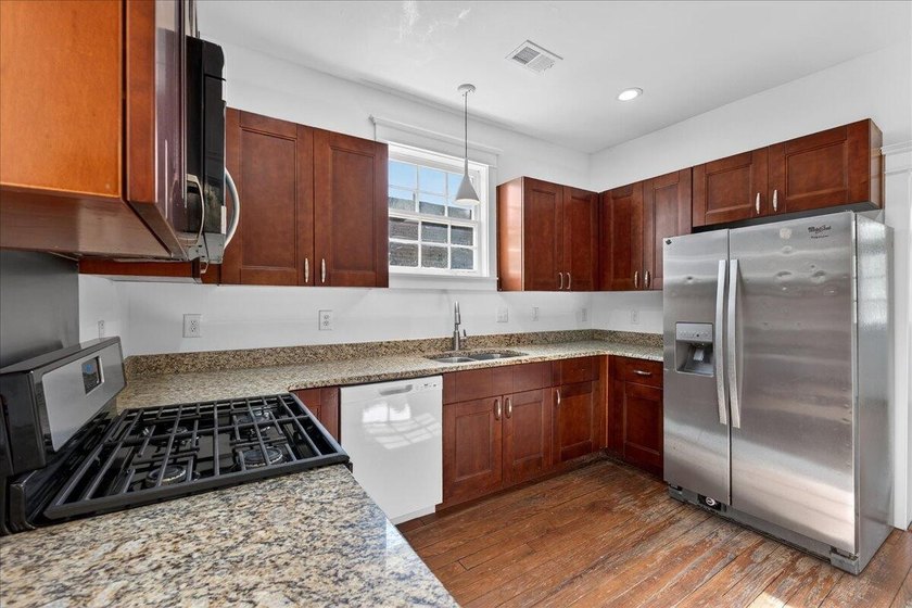 This beautifully renovated historic duplex features two units - photo 5