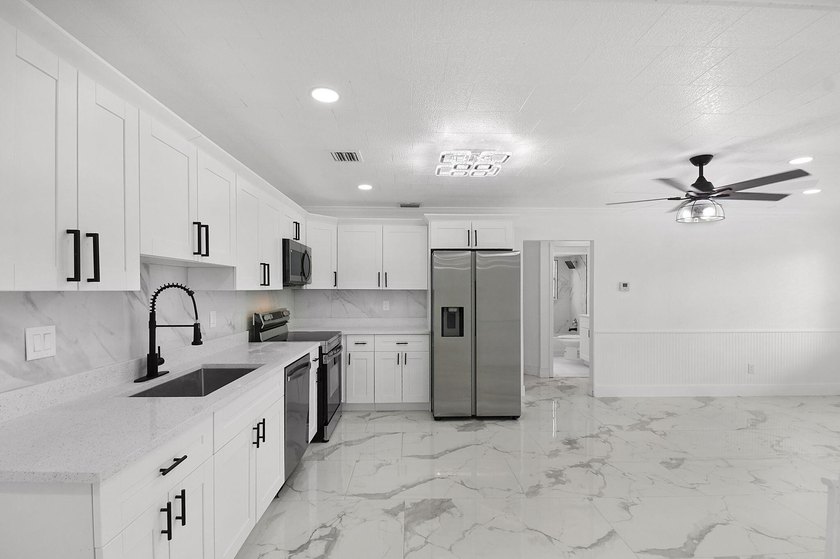 Fully renovated 3-bedroom, 2-bath home featuring a desirable - photo 11