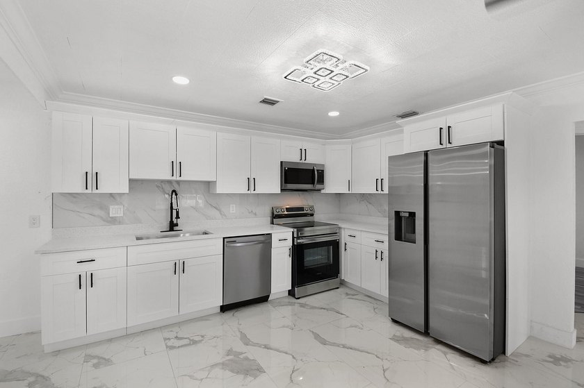 Fully renovated 3-bedroom, 2-bath home featuring a desirable - photo 14