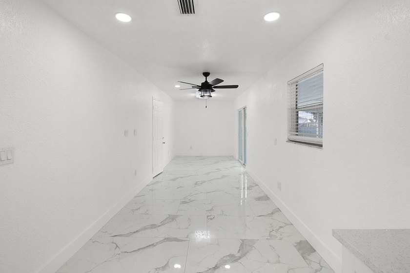 Fully renovated 3-bedroom, 2-bath home featuring a desirable - photo 15