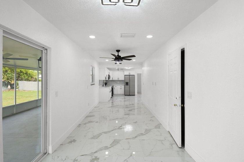 Fully renovated 3-bedroom, 2-bath home featuring a desirable - photo 16