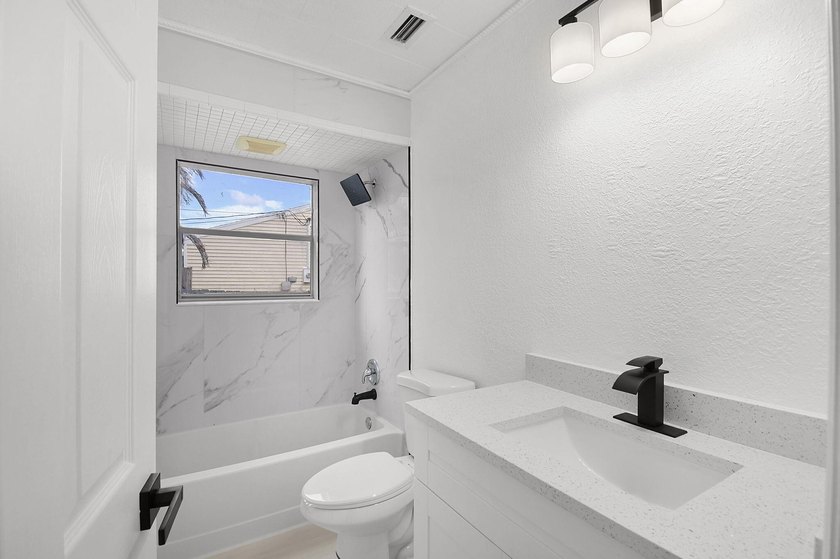 Fully renovated 3-bedroom, 2-bath home featuring a desirable - photo 26