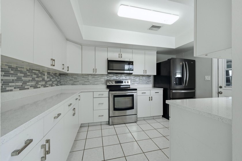 Lakefront living at its finest! Enjoy breathtaking panoramic - photo 12