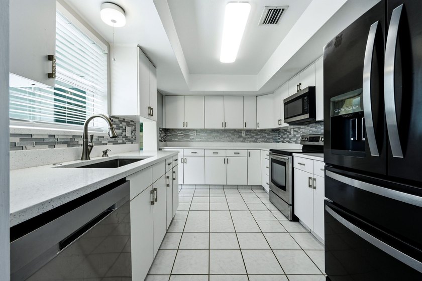 Lakefront living at its finest! Enjoy breathtaking panoramic - photo 14