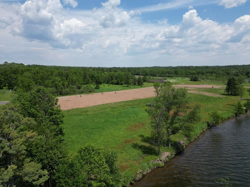 Beautiful Level Lot On Big Butternut Lake. Have your own Builder - photo 3