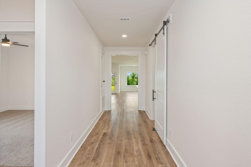 New construction 3BR/2BA home in Game Farm subdivision featuring - photo 6