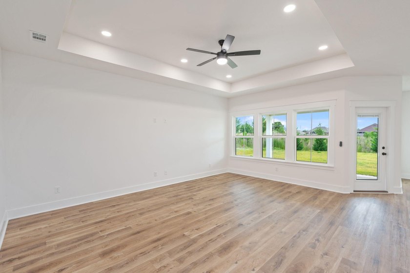 New construction 3BR/2BA home in Game Farm subdivision featuring - photo 7