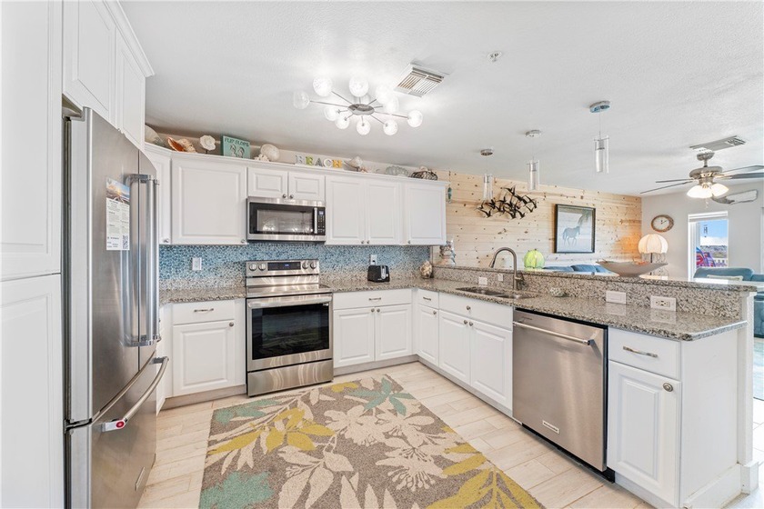 BEACHFRONT BEAUTY! Fabulously updated, this spacious 3-bedroom - photo 12