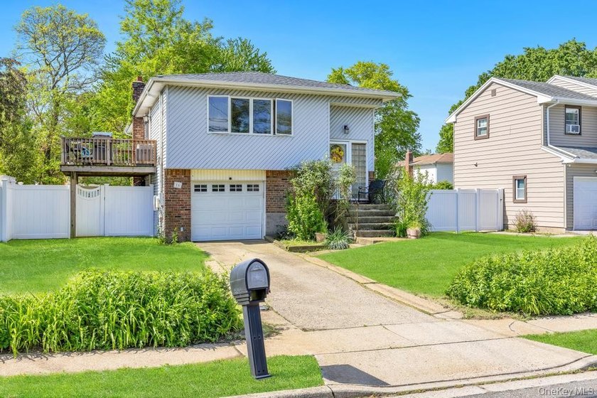 Welcome to 16 E Grove Street in Massapequa - a spacious and - photo 3