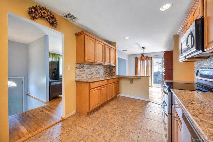 Welcome to 16 E Grove Street in Massapequa - a spacious and - photo 9
