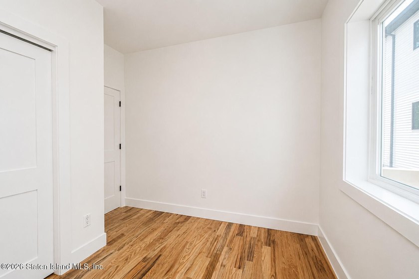 An exceptional new construction 6/6 two-family home offering 2 - photo 13