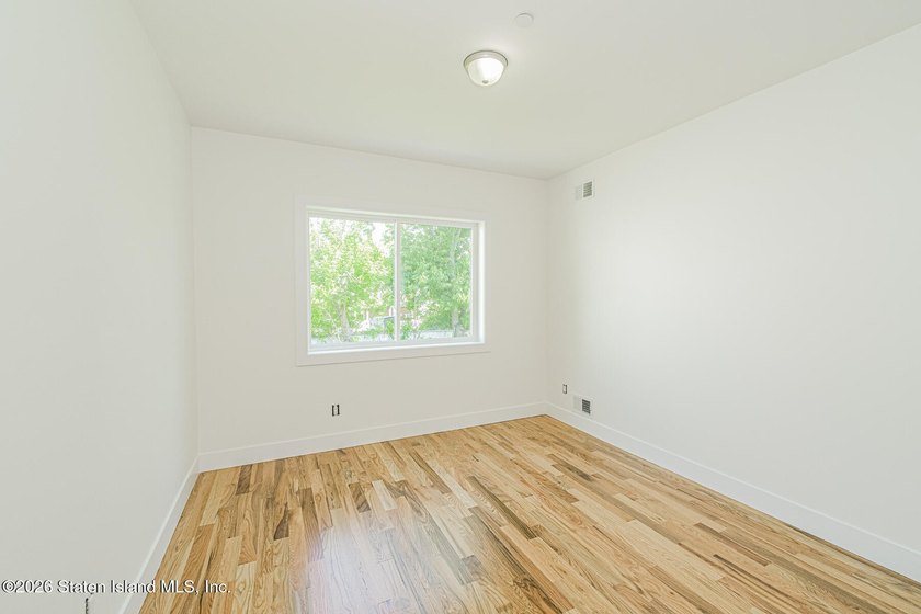 An exceptional new construction 6/6 two-family home offering 2 - photo 15