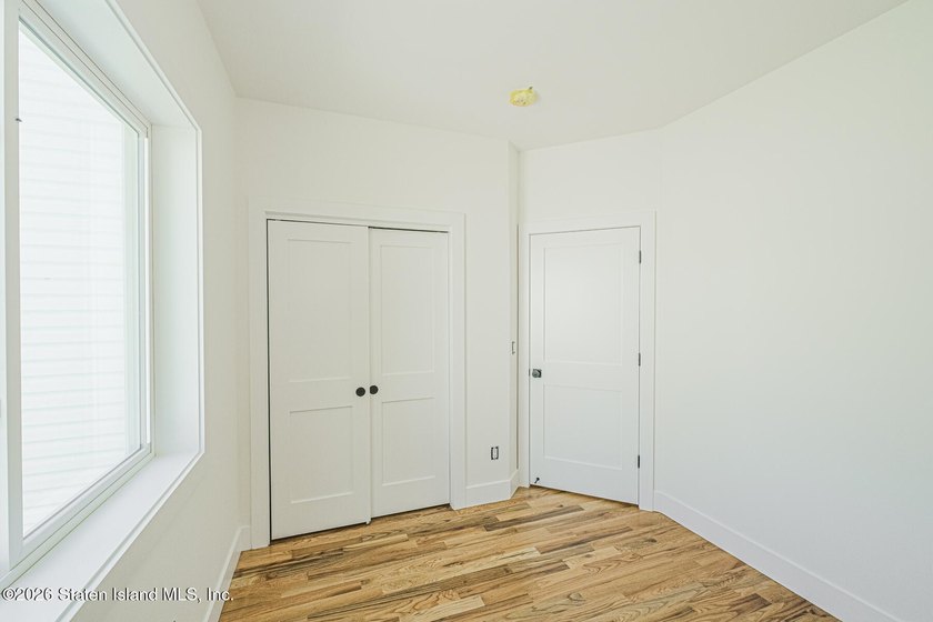 An exceptional new construction 6/6 two-family home offering 2 - photo 17