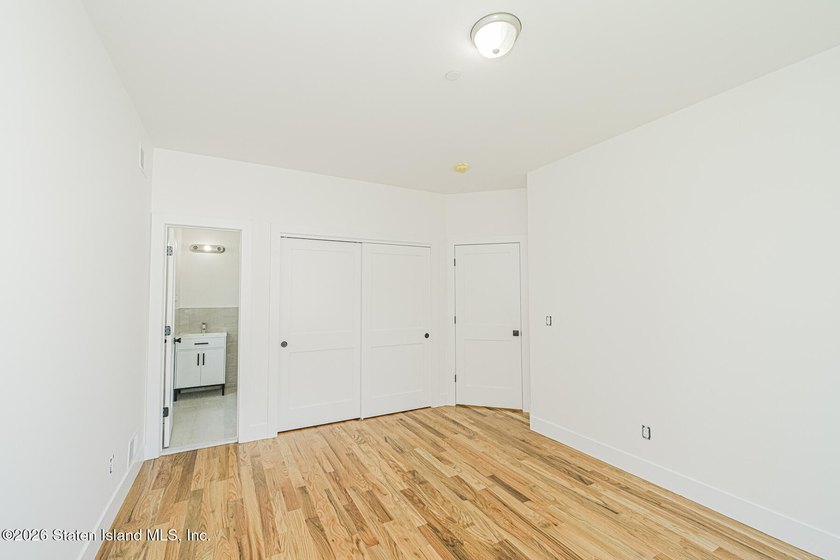 An exceptional new construction 6/6 two-family home offering 2 - photo 20