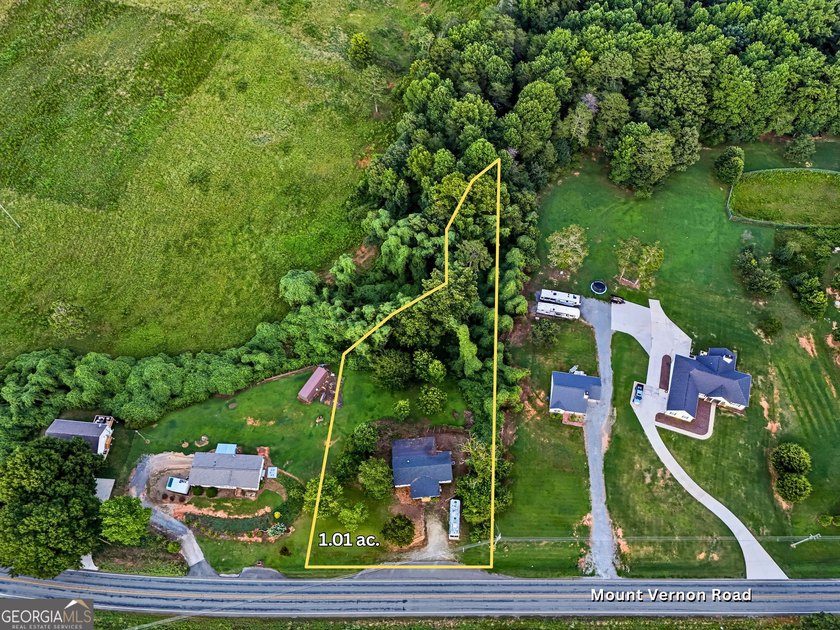Opportunity awaits in North Hall! Situated on over an acre in - photo 2