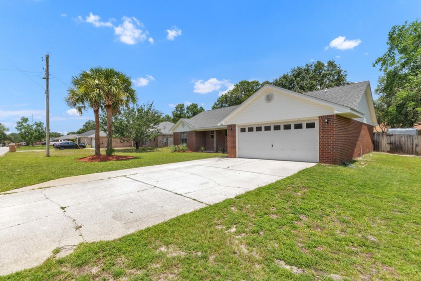 This charming brick home delivers a warm, functional layout - photo 3