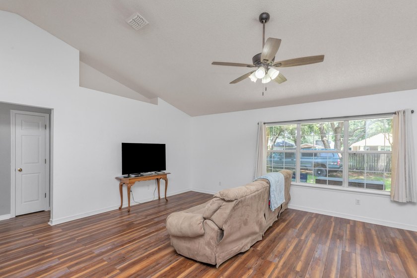 This charming brick home delivers a warm, functional layout - photo 5