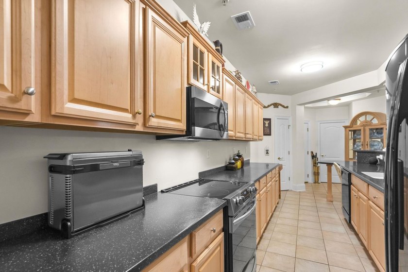 Beautifully positioned within Barefoot Resort &amp; Golf, this - photo 21