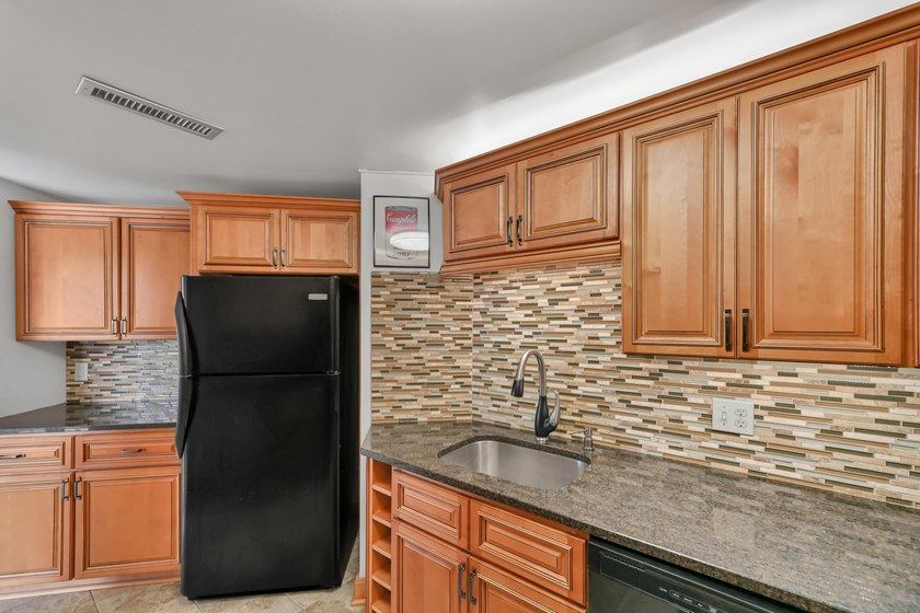 Experience elevated city living in this beautifully maintained - photo 11