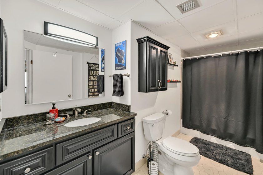 Experience elevated city living in this beautifully maintained - photo 13