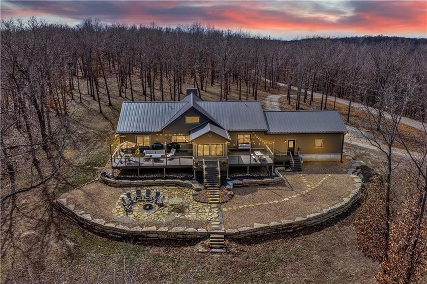 Indulge in waterfront living on approximately 5 serene acres at - photo 4