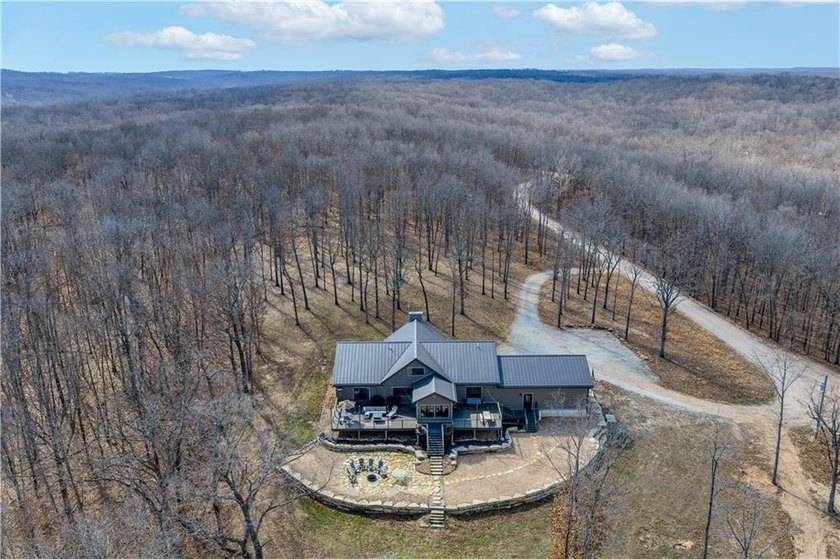 Indulge in waterfront living on approximately 5 serene acres at - photo 6
