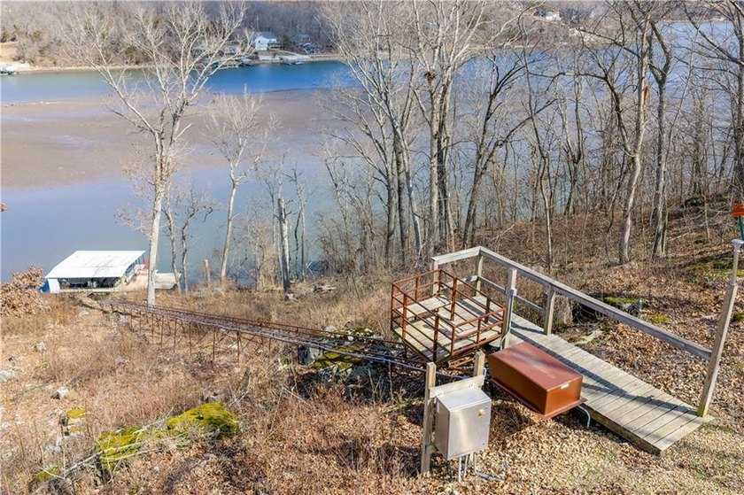 Indulge in waterfront living on approximately 5 serene acres at - photo 7
