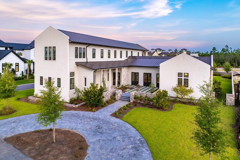 A showstopper of modern coastal elegance, 36 Sandcord Drive is a - photo 5