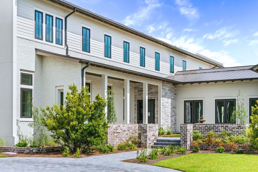 A showstopper of modern coastal elegance, 36 Sandcord Drive is a - photo 7