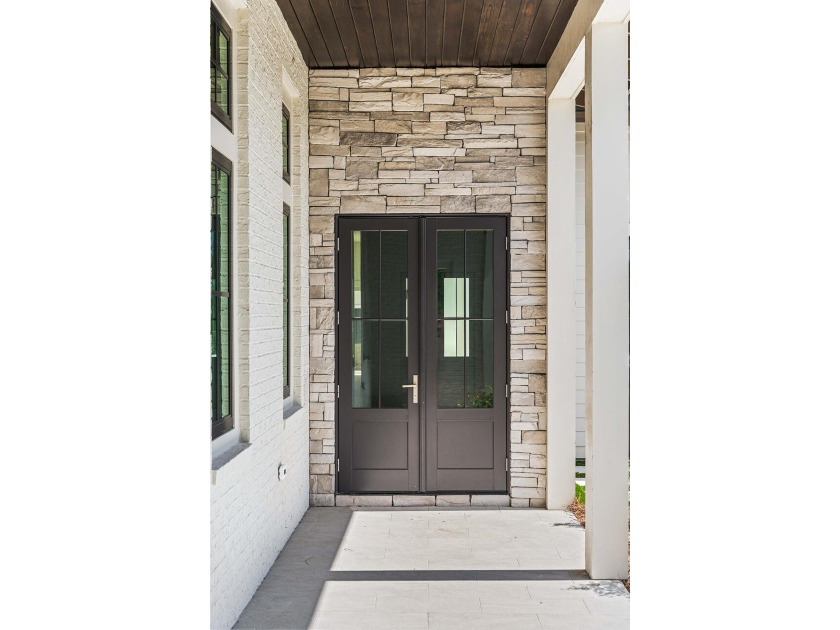 A showstopper of modern coastal elegance, 36 Sandcord Drive is a - photo 10