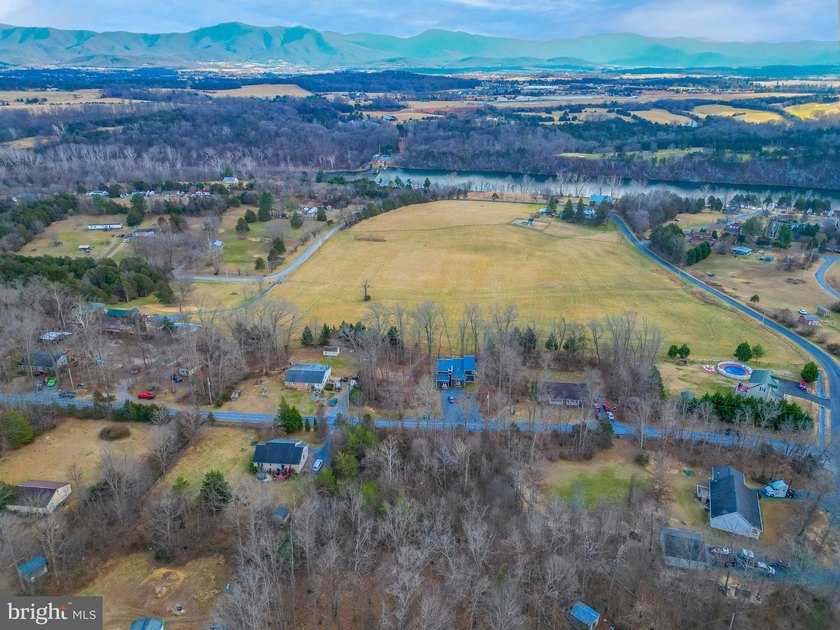 Discover the possibilities on Riverbend Drive. Tucked within a - photo 4