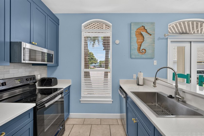 Discover coastal living just steps from the sugar-white sands of - photo 6