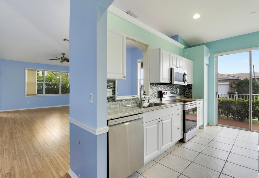 This spacious end-unit home is vacant and move-in ready! Tucked - photo 9