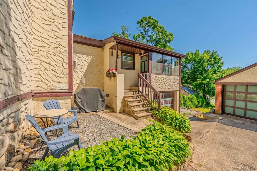 Picture-perfect 3-bedroom, 1.5-bath Tudor set on a tree-lined - photo 3