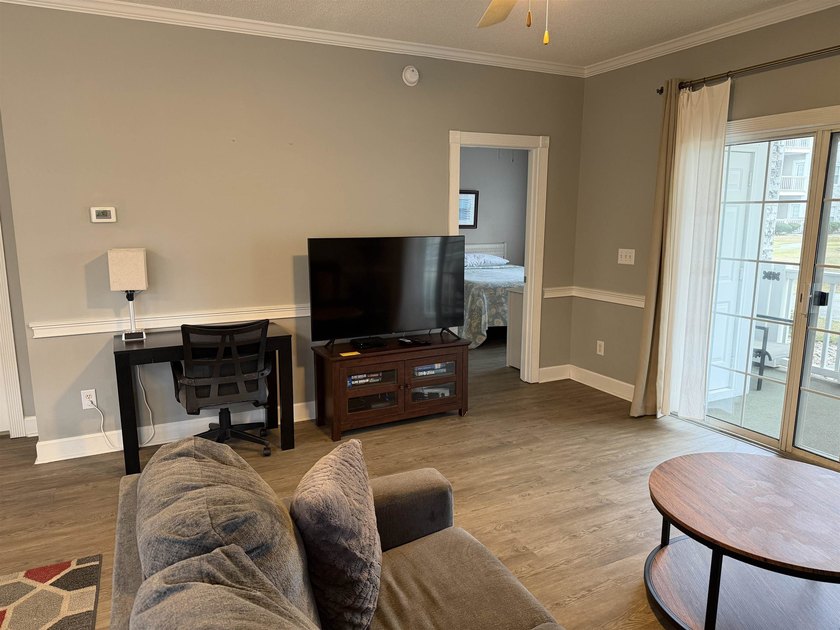 Welcome home to this golf course view condo located in the - photo 2