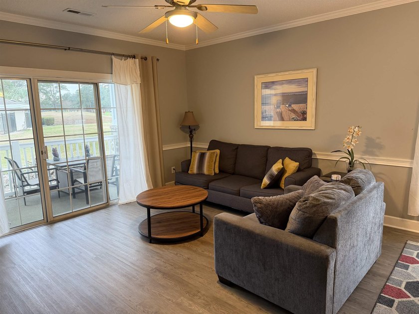 Welcome home to this golf course view condo located in the - photo 3