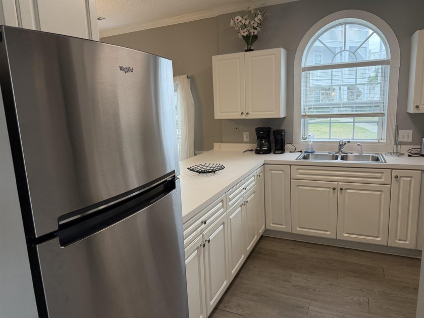 Welcome home to this golf course view condo located in the - photo 7