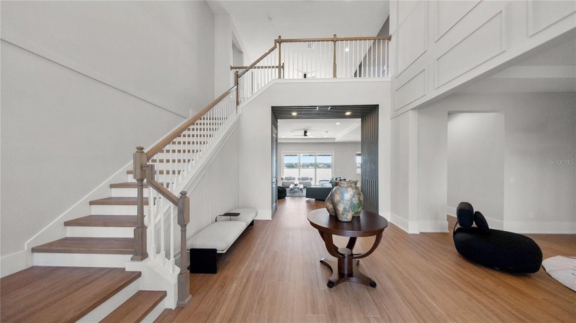 This never-lived-in luxury residence presents an extraordinary - photo 4