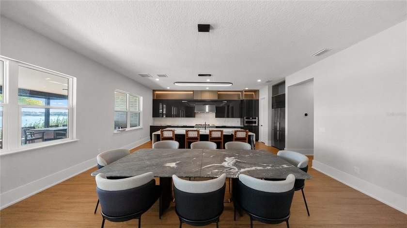 This never-lived-in luxury residence presents an extraordinary - photo 10