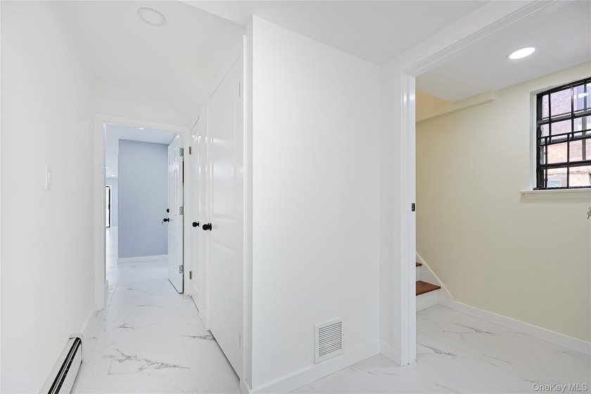 Welcome to this fully renovated 2-Family Condo Townhouse located - photo 7