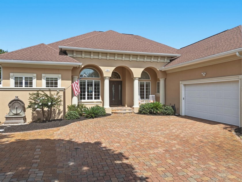 Nestled within the gated community of Soundside Shores, this - photo 3