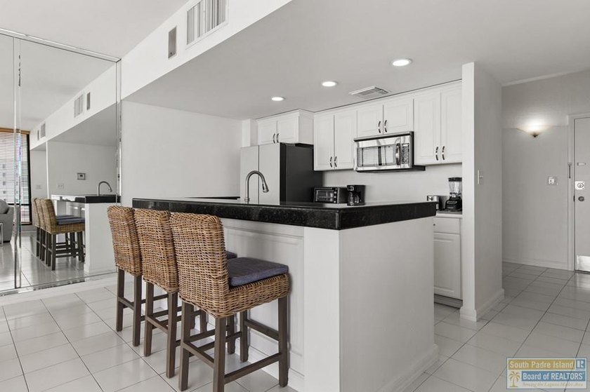 Beautifully updated townhome-style condo with stunning views of - photo 6